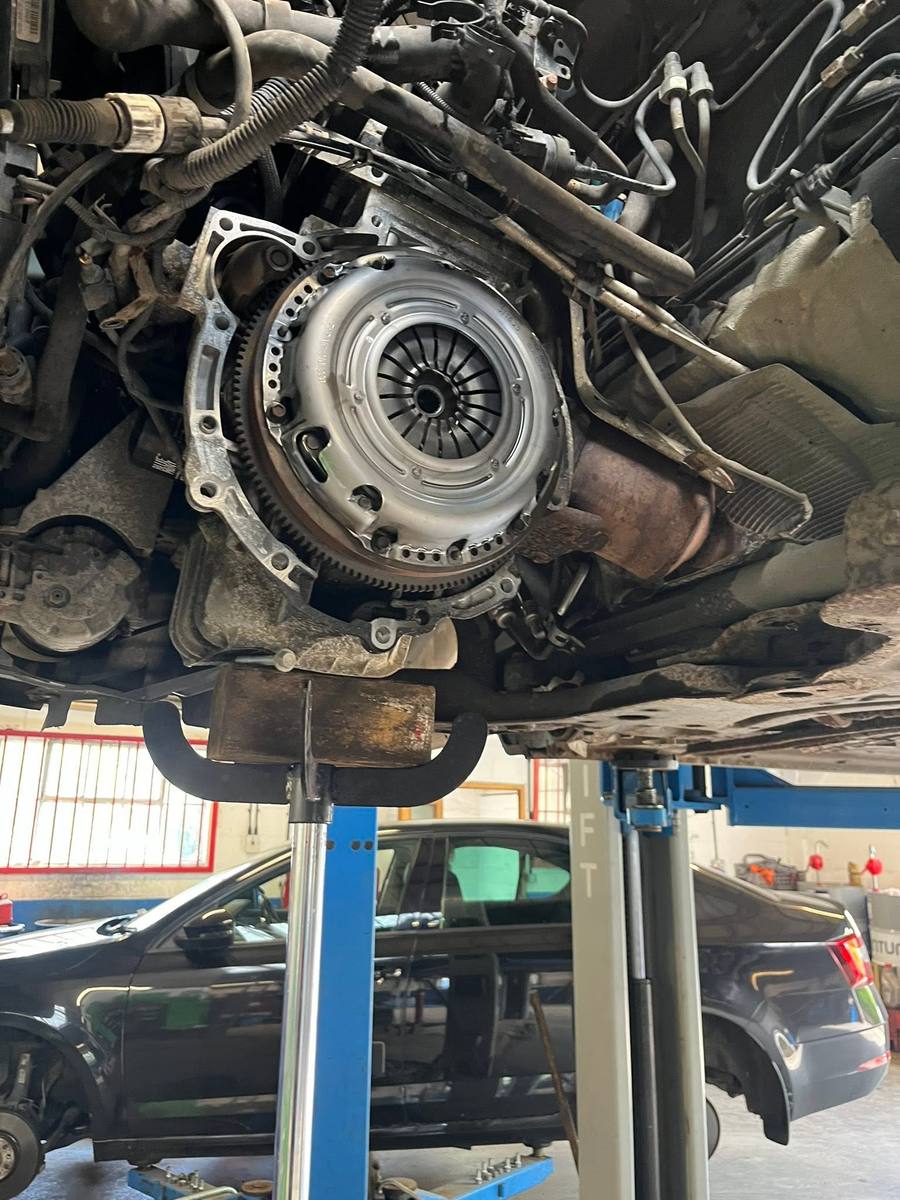 Clutch pressure plate fitted, viewed from under the car