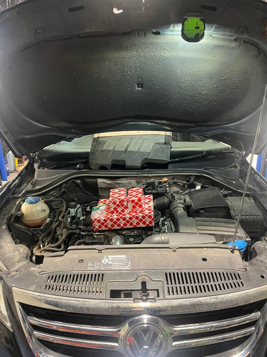 VW engine bay with new service parts ready to fit