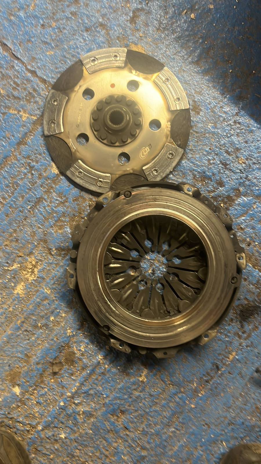 Worn clutch plate and pressure plate after removal